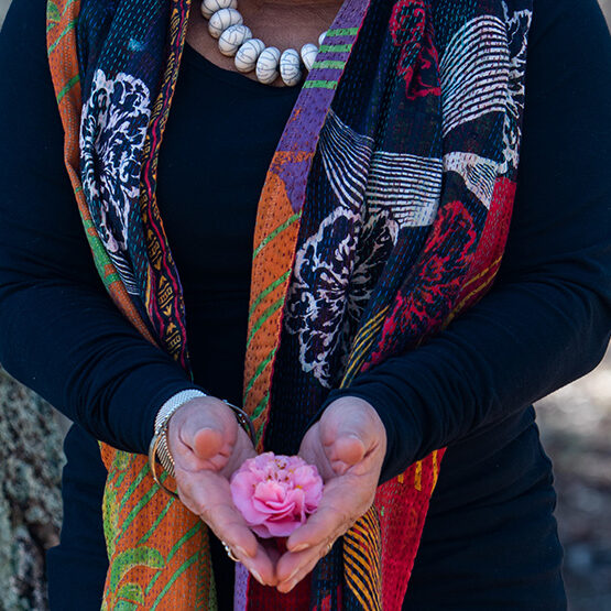 Ruth holding small lotus in cupped hands